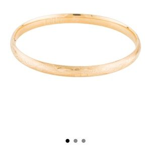 14K yellow gold textured bangle- very good condition as new.